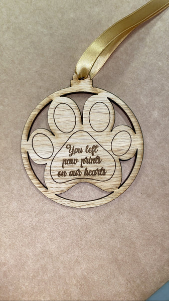 You left paw prints on our hearts/on my heart oak veneer bauble